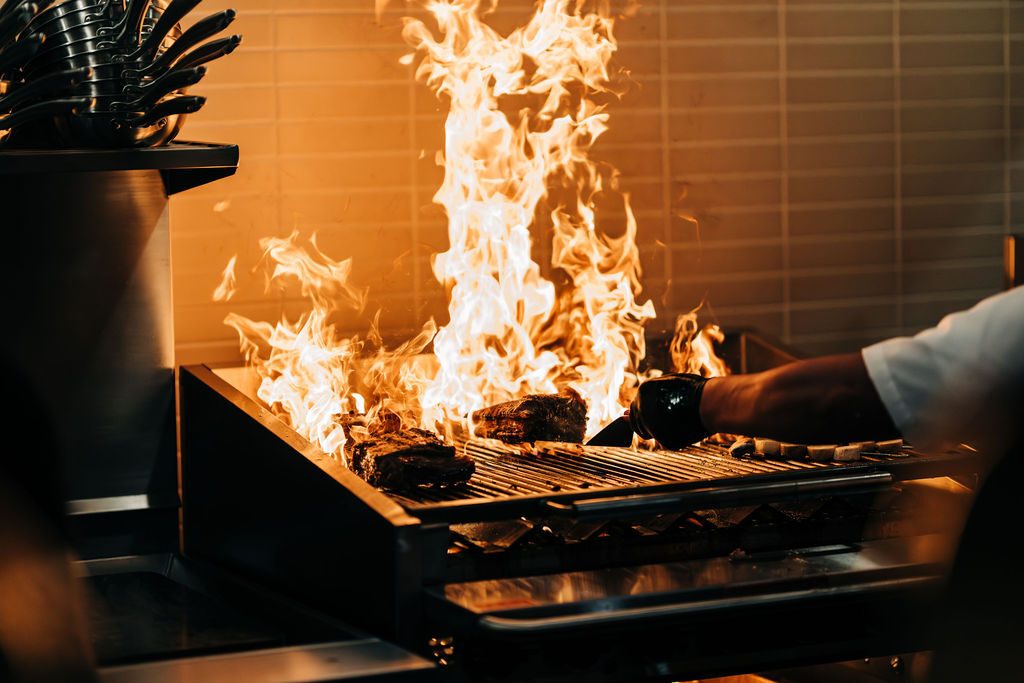 Charcoal flames on the grill
